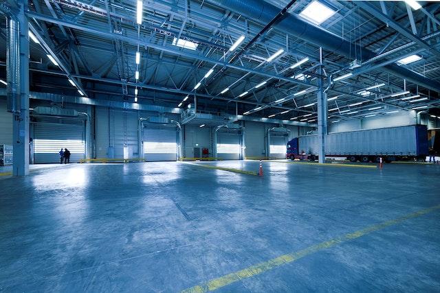 A large open warehouse that is home to a fleet operations facility.