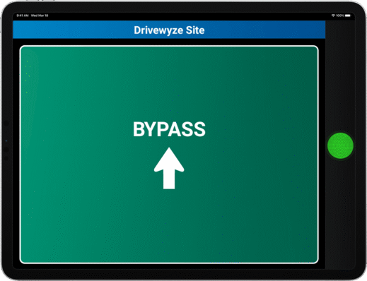 A tablet screen displaying Drivewyze Site at the top features BYPASS and an upward arrow in white text on a green background, indicating a bypass instruction for efficient trucking. This preclear directive seamlessly integrates with your ELD system.