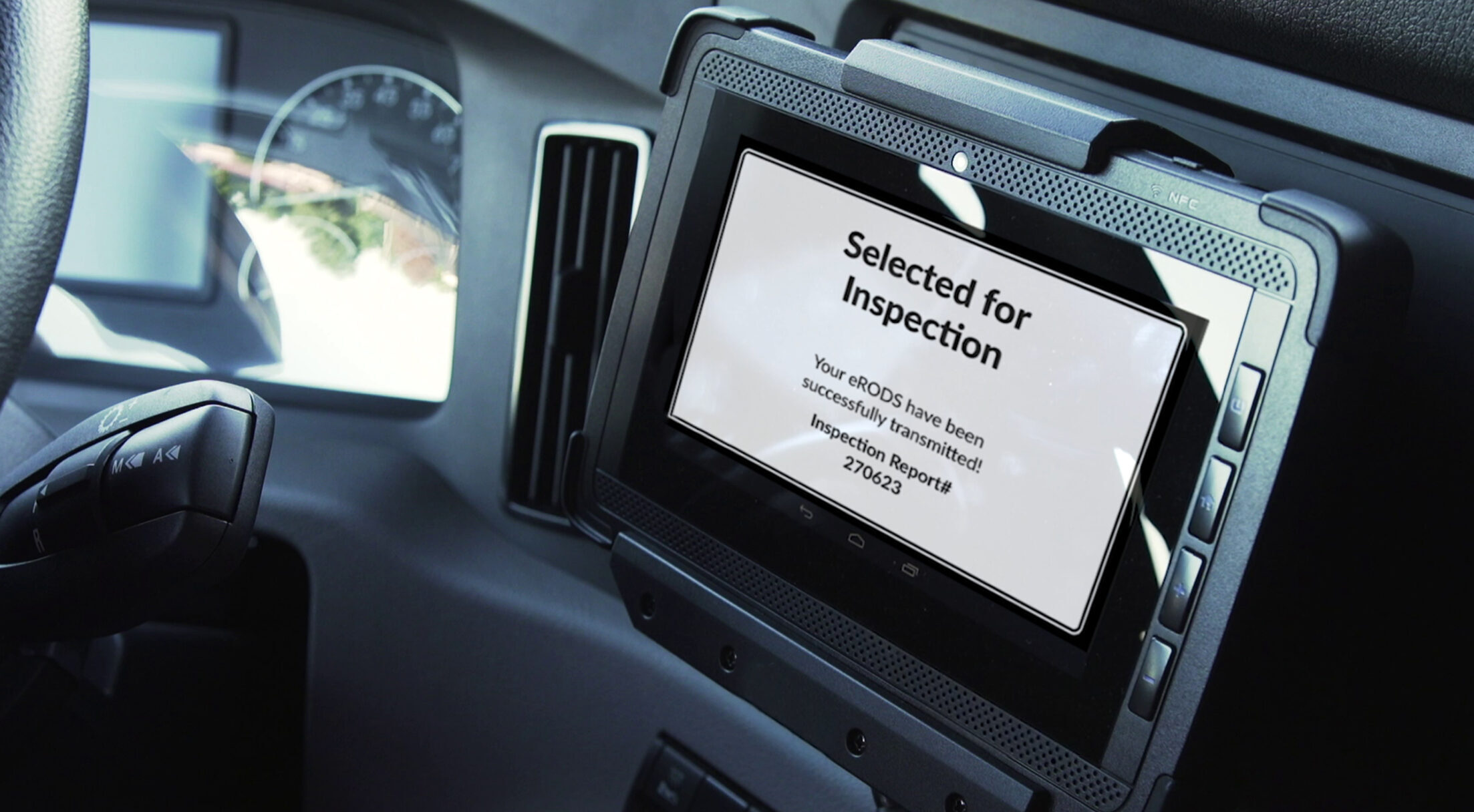 A tablet mounted on a vehicle dashboard displays Selected for Inspection, notifying the driver their ELDs are up for compliance review. The Fleetworthy logo, now reflecting Fleetworthy Acquires Haul, appears in the lower right corner.