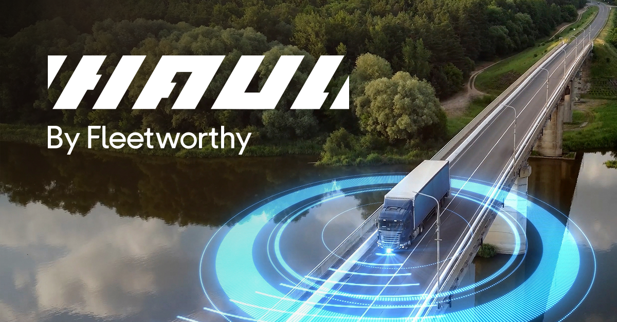 A semi-truck crosses a bridge over a river, surrounded by trees, with digital blue concentric circles highlighting technology. Text reads HAUL By Fleetworthy in bold white letters, showcasing the impact since Fleetworthy Acquires Haul.